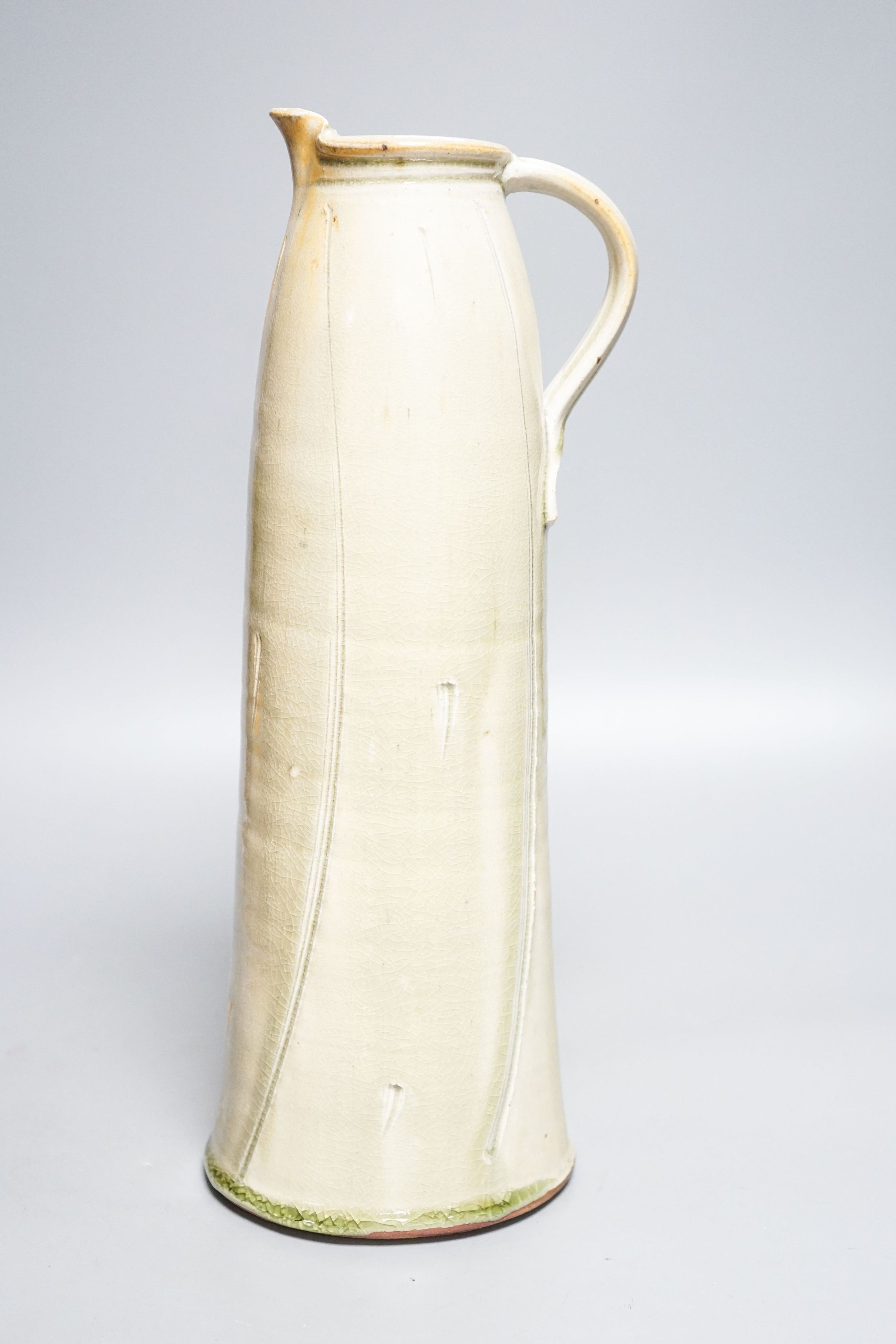 Stephen Parry (b.1950), a tall pale celadon glazed jug 39cm